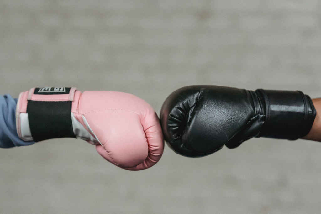 Trust - two stranger boxers fist bumping before a fight - Photo by Julia Larson on pexels