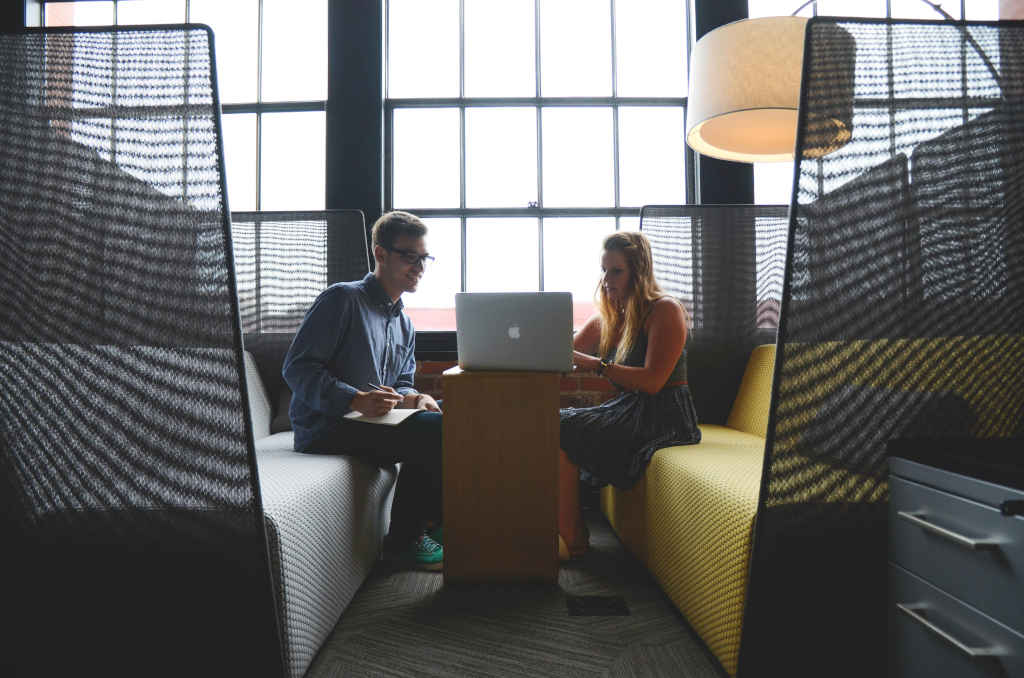 Coworkers looking at laptop - Photo by Startup Stock Photos on pexels